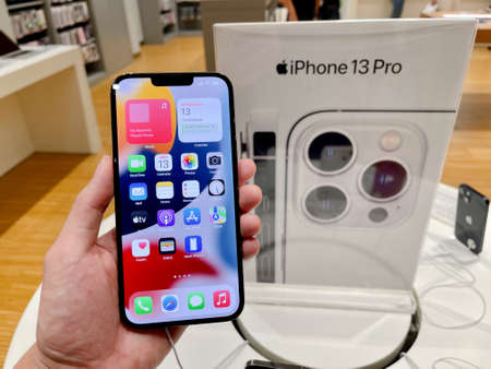 Bangkok, Thailand - October 13, 2021: Hands on iPhone 13 series are shown to sell in iStudio By Comseven - EMQUARTIER DEPARTMENTSTORE in Bangkok, Thailandのeditorial素材