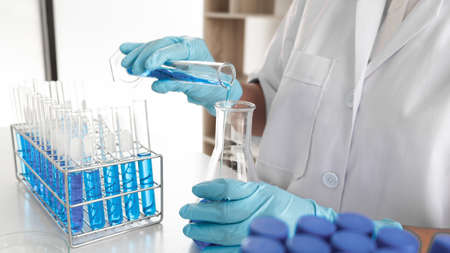 Female scientist are experimenting in the laboratory, science concept, virus, chemical.の写真素材