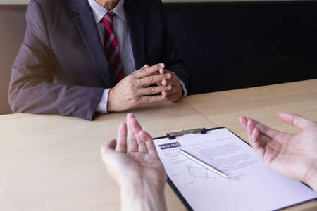 Job seeker talking and presentation about himself with interview employee for job interview in the...