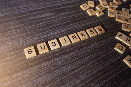Words of business with collected of wooden blocks.