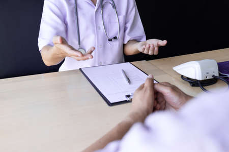 Senior patient having listening and consultation with doctor in the hospital, Medical and health care concepts.の写真素材