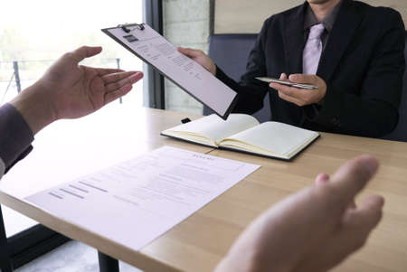 Job seeker talking and presentation about himself with interview employee for job interview in the office, Job applications concepts.の写真素材