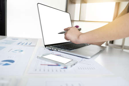 Business women is working with computer notebook for analyze marketing strategy from the sell performance graph in the office room, Finance and accounting concept.の写真素材