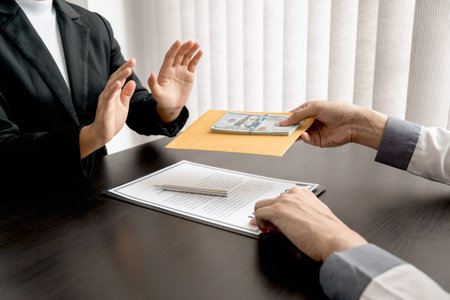 Female officer is refuses to accept bribes from customers, Corruption concept.の写真素材