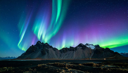 Beautiful aurora borealis over mountains in Iceland, Scandinaviaの素材