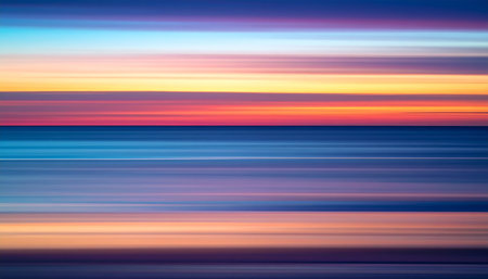 blurred light trails colorful background of sunset or sunrise over the oceanの素材