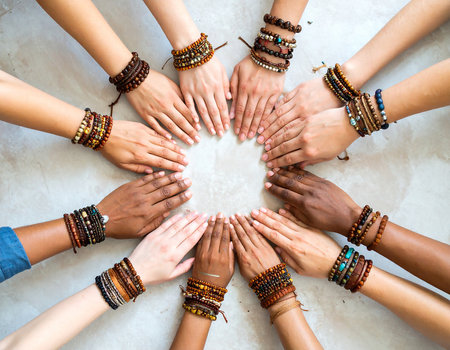 Top view of group of multiracial women wearing bracelets and ringsの素材