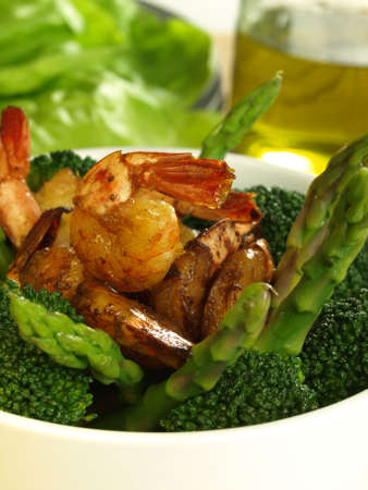 Broccoli and asparagus with fried shrimpsの写真素材