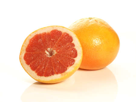 One and half of pink grapefruit on isolated backgroundの写真素材