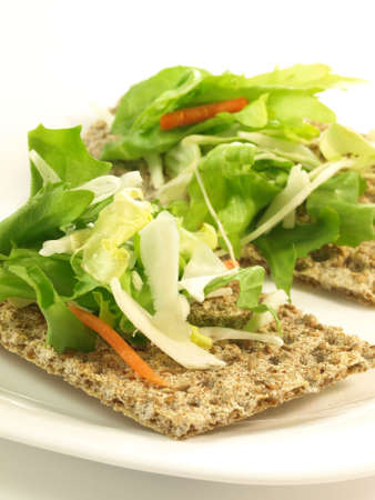 Slices of crispbread with fresh lettuce, close up