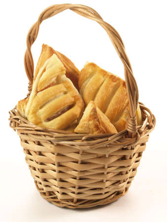 Cookies with filling in basket on isolated backgroundの写真素材