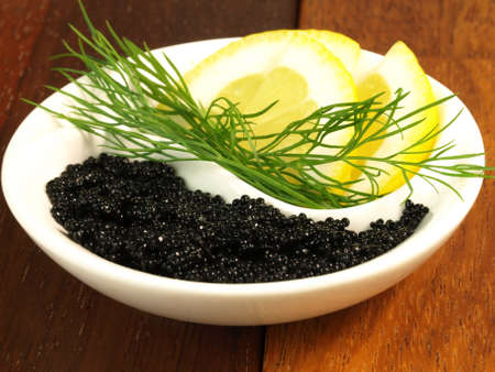 Yin yang symbol made of caviar and lemonの写真素材