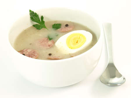 Traditional poilsh white borsht served in the bowlの写真素材