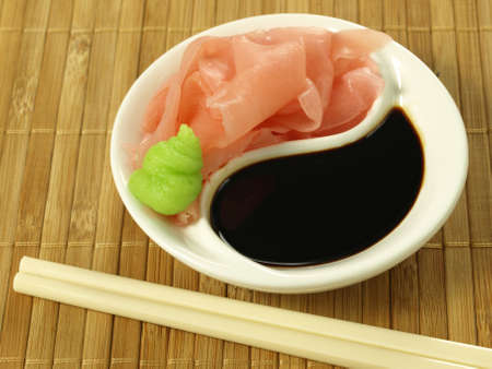 Marinated ginger with balsamic vinegar and chopsticksの写真素材