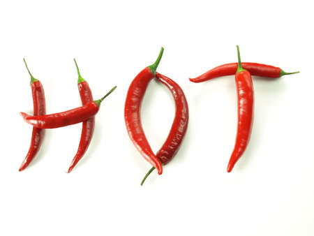 Hot word made with chili pepper on isolated backgroundの写真素材
