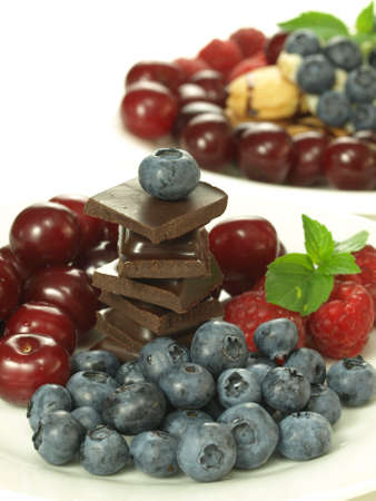 Sweetness from healthy fruits and harmful chocolateの写真素材