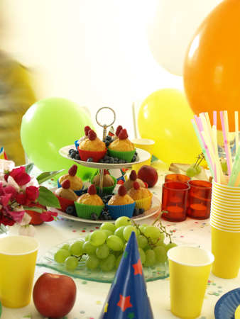 Cookies and grapes on colorful decorated table