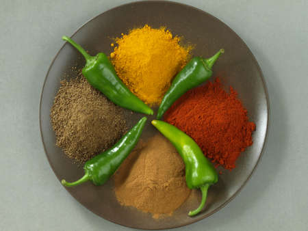 Cumin, pepper, cinnamon and turmeric, bird eye view