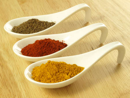 Indian cuisine additions: cumin, turmeric and pepperの写真素材