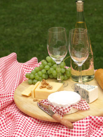 Closeup of board with different types of cheeseの写真素材