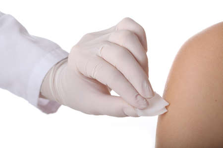 Doctor disinfecting an arm before injection, isolated