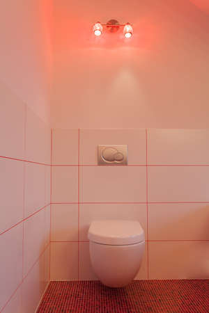 Ruby house - Toilet in modern interior; red and white bathroomの写真素材