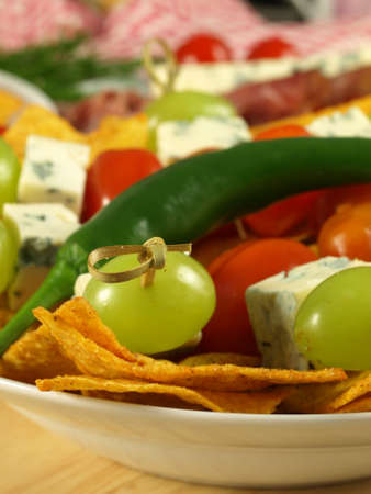 Closeup of party sticks with grapes, cheese, chiliの写真素材