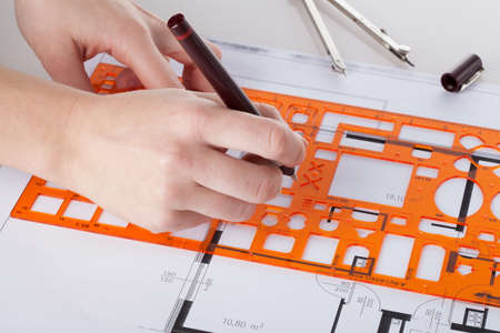 Closeup of architect's hand making project of a house