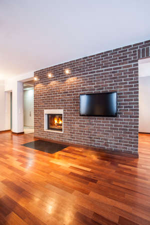 Country home - Brick wall in contemporary living roomの写真素材