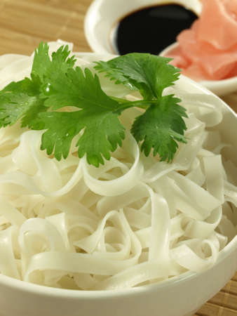 Closeup of rice flat noodle with marinated ginger