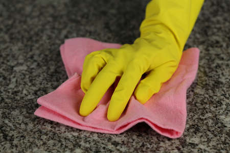 Washing a countertop in kitchen with rubber