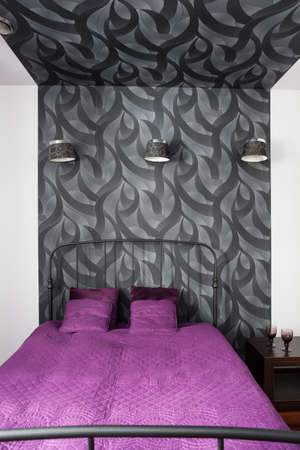 Country home - modern bed in patterned bedroom interiorの写真素材