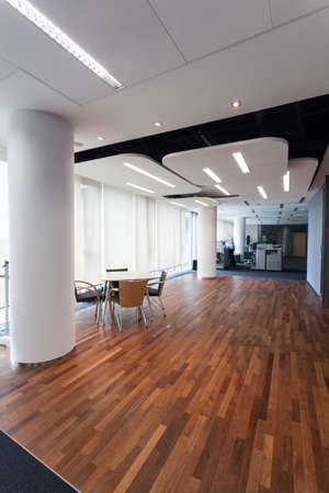 Luxurious office with designers lighting and exotic wooden floorの写真素材
