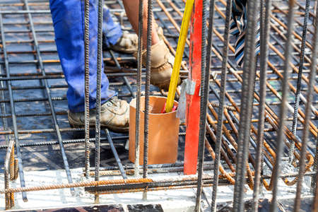 Making a construction with a metal rods, closeup
