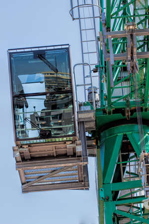 Operator's cabine of a crane at sky backgroundの写真素材