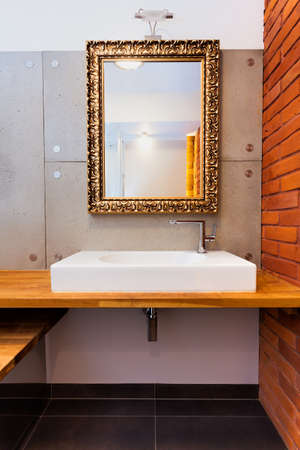 Luxury mirror and wash basin in a modern bathroom