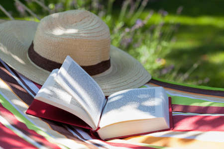 A book and a hat lying on a hammock A book and a hat lying on a hammock