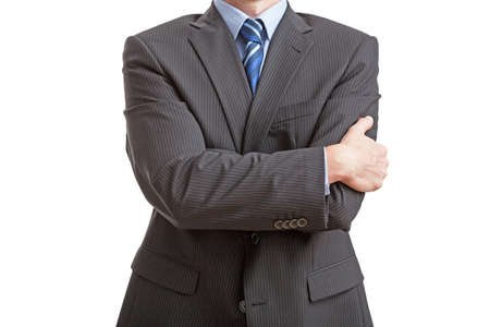 Businessman standing with closed posture, isolatedの写真素材