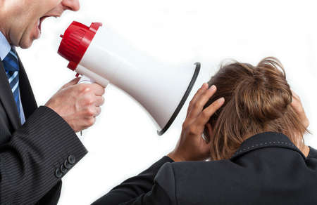 Businessman yelling at his worker, isolated backgroundの写真素材
