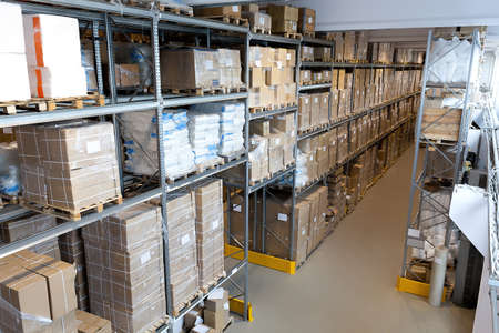 Interior of a spacious warehouse with metal stillage