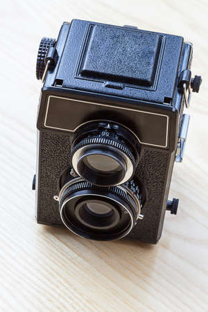 A black old twin-lens camera viewed from the top