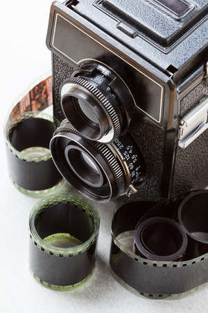 A photo set consisting of a vintage camera and rolls