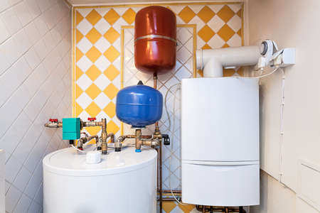 Vintage mansion - a boiler room with containers and pipesの写真素材