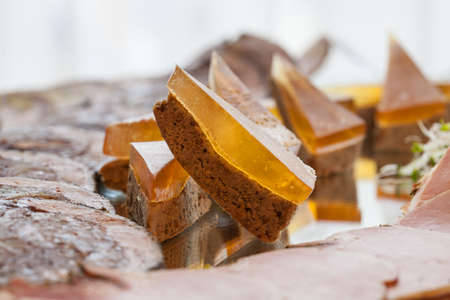 A closeup of small pieces of a jelly chocolate cakeの写真素材