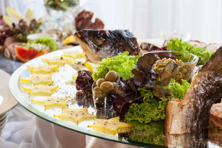 Different appetizers on a luxury banquet tableの写真素材
