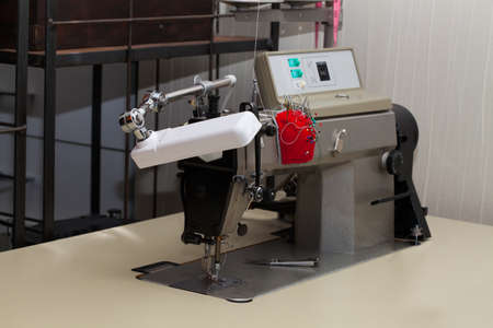 Sewing machine in tailor shop, close up