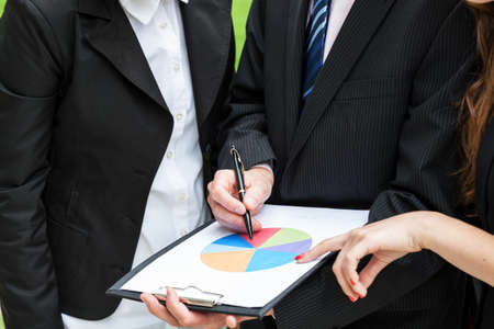 Business meeting and analysing the pie chartの写真素材