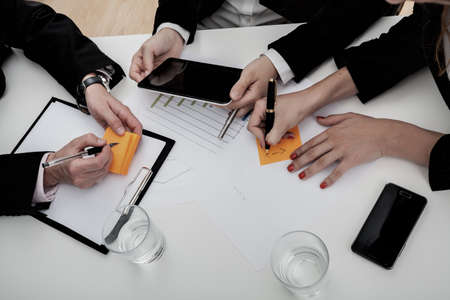 Team of business people on the meeting, chart analysis