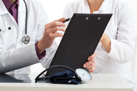 Two doctors discussing medical issues on a medical council