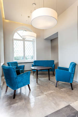 Vertical view of a turquoise living room